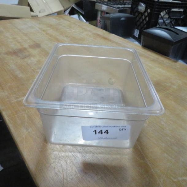 Clear 1/2 size 6-inch deep food storage container, clean condition, marked with auction label "144".
