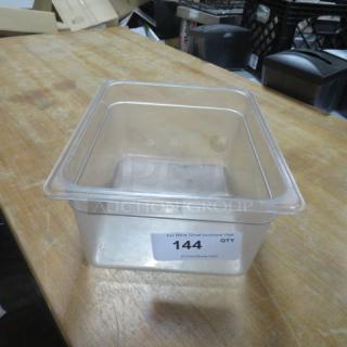 Clear 1/2 size 6-inch deep food storage container, clean condition, marked with auction label "144".