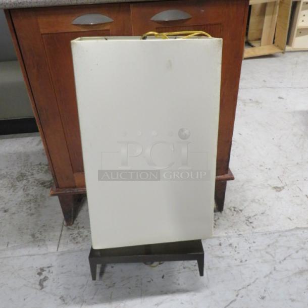 Brown metal lamp with one light and a beige rectangular shade. Sturdy construction, modern design. Good condition.