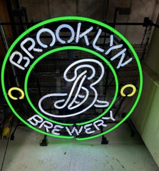 Brooklyn Brewery neon sign, working condition, features green and white lights with logo design.