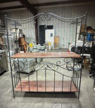 Decorative wine bar with metal frame, two wooden shelves, and wine glass racks, measuring 60x22x70. Intricate scrollwork design.