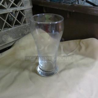 Clear 12oz pilsner beer glass, new condition. Smooth contours, wide rim, sturdy base. Model 12XBID.