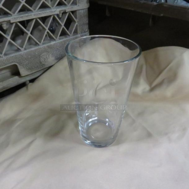 20oz clear beer glass, cylindrical shape, in excellent condition.