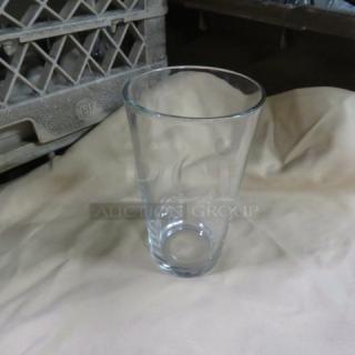 20oz clear beer glass, cylindrical shape, in excellent condition.