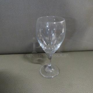 Clear stem wine glass, model 12XBID, in excellent condition. Elegant design on textured surface.