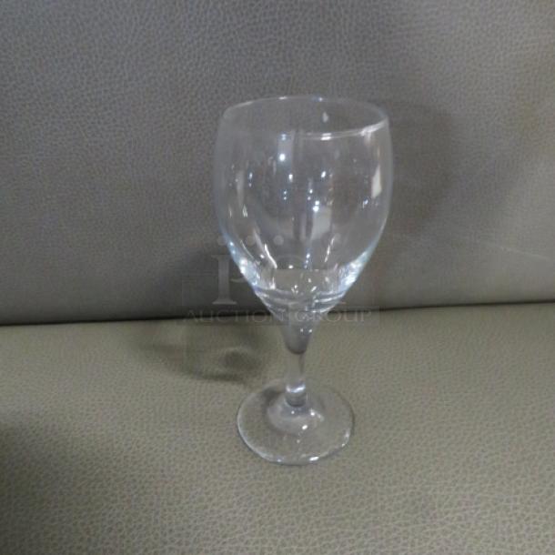 Clear stem wine glass, simple design, excellent condition, no visible markings or labels, ideal for dining or collecting.