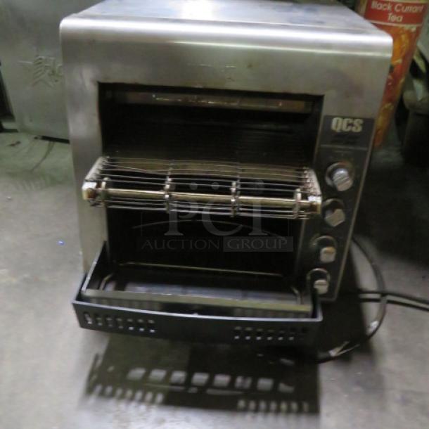 Star One Star Conveyor Toaster, Model QCS-2-80C, 208 Volt. Dimensions: 14.5"x23"x16". Used; features QCS branding on controls.