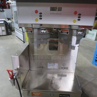 Bunn Dual Coffee Brewer, Model DUAL SH DBC, with 2 filter baskets, stainless steel, 120/208 Volt, used condition, visible safety labels.
