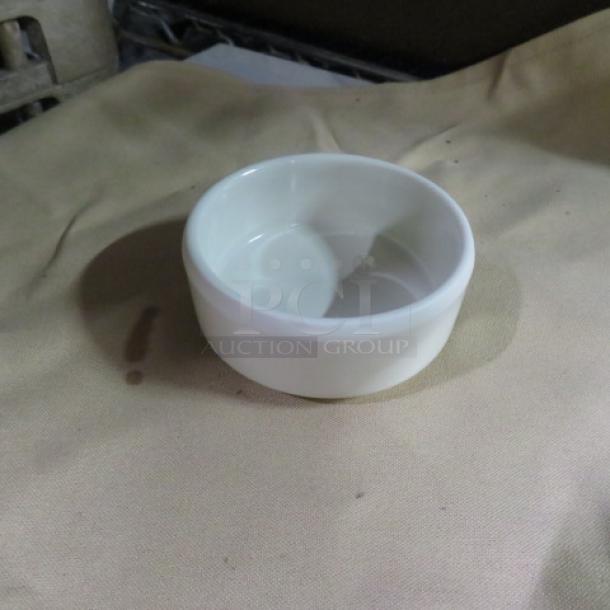 New 2oz white melamine ramekin, part of a case of 60. Durable, lightweight, ideal for sauces or desserts.