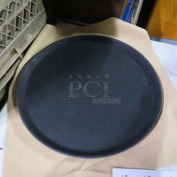 16-inch waitress tray, round, black, used condition. Ideal for serving in restaurants or cafes. Marked 3XBID.