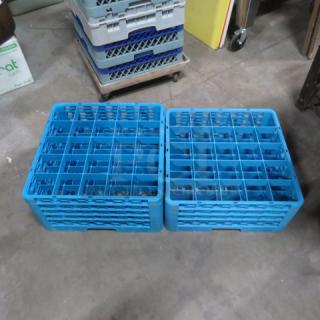 Blue 25-hole deep dishwasher rack, set of two. Durable plastic, excellent condition, ideal for commercial use. Model: 2XBID.