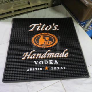 Tito's bar mat, new, 16x16, black with orange logo and white text, "Handmade Vodka, Austin, Texas."