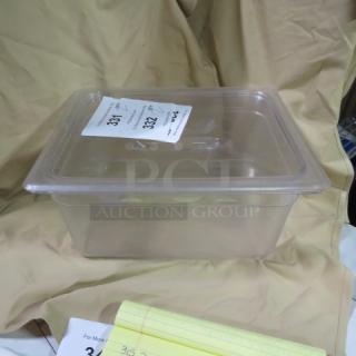 1/2 size 6-inch deep clear food storage container with lid. Visible tag "2XBID" indicating auction lot number.