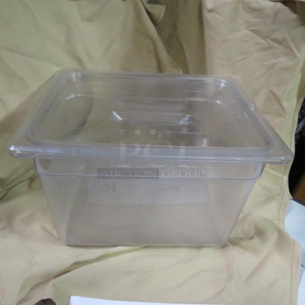 1/2 size 8-inch deep clear food storage container with lid. In good condition, ideal for kitchen organization and storage.