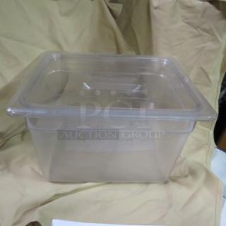 1/2 size 8-inch deep clear food storage container with lid. In good condition, ideal for kitchen organization and storage.