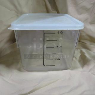 Clear 6-quart food storage container with white lid, measurements marked on the side, in good condition.