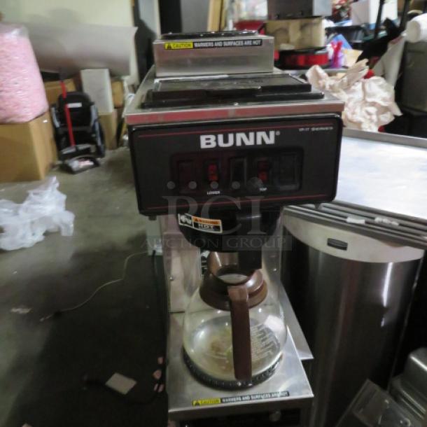 Bunn VP17-2-SST coffee brewer with top warmer, filter basket, and 1 pot. 120 Volt. Model #VP17-2-SST. Condition: Used.