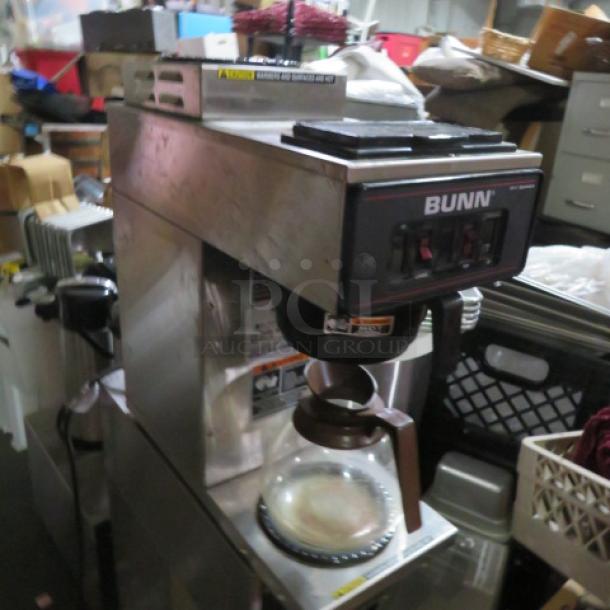 Bunn VP17-2-SST coffee brewer with top warmer, filter basket, and glass pot. 120V, stainless steel, 8"x18"x19".