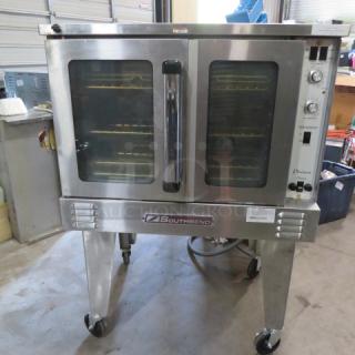 Southbend electric convection oven, model PDE75S/SD, with 5 racks, on caster stand. Stainless steel, excellent condition.