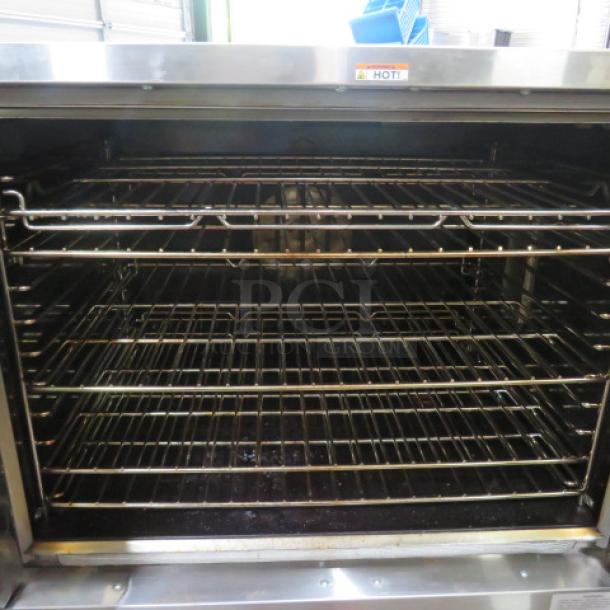 Southbend Electric Convection Oven Model PDE75S/SD with 5 racks, on stand with casters, working condition, visible "HOT" label.