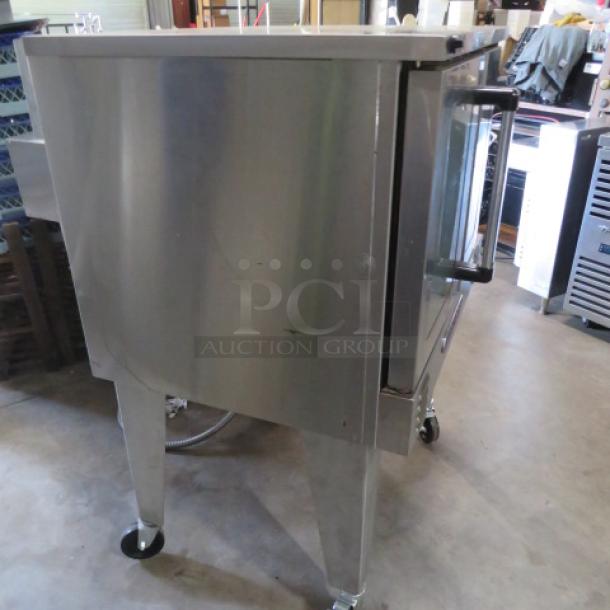 Southbend PDE75S/SD electric convection oven, stainless steel, on casters, includes 5 racks, excellent condition.