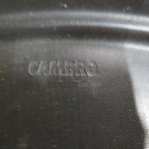 Cambro serving tray, 27x22 inches, embossed logo, black surface, shown in good condition with minor wear.
