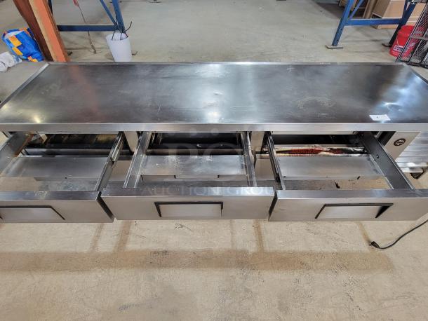 True TRCB-110 110" Chef Base, 6 stainless steel drawers, commercial kitchen use, sturdy, great condition, enhances workflow.