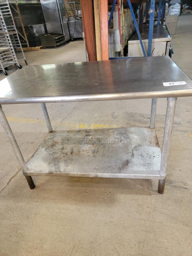 Stainless Steel Work Table - Heavy Duty! Get this sturdy 4-foot stainless steel work table! Perfect for kitchens, garages, workshops, or any commercial space. Durable metal base. - Image 2 of 2