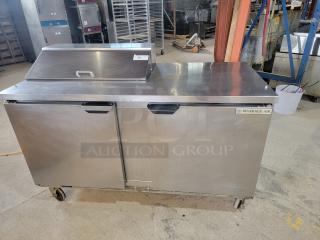 Beverage-Air SPE60HC-08: 60-inch Elite Series Refrigerated Prep Table! 60-inch, two-door refrigerated sandwich/salad prep table in excellent working and cosmetic condition. This is a robust and highly sought-after unit, perfect for restaurants, delis, cafes, or any food service operation needing efficient cold storage and prep space. Tested and working!