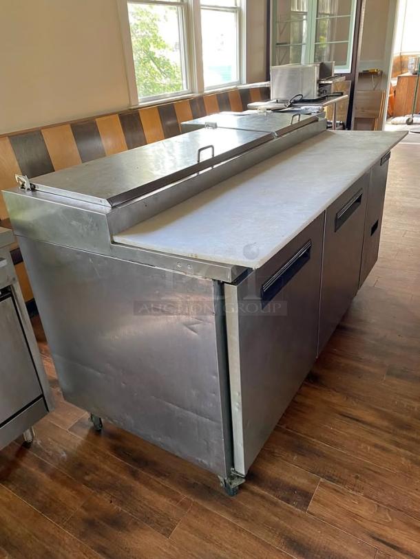 Central Exclusive 69K-014 Commercial Pizza Prep Table! This robust stainless steel unit offers ample space for ingredients and a convenient workspace, making it an indispensable asset for pizzerias, delis, restaurants, or any commercial kitchen needing efficient food preparation. - Image 1 of 3