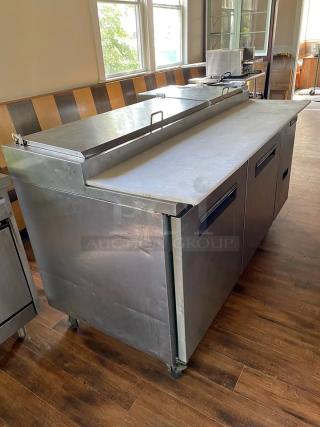 Central Exclusive 69K-014 Commercial Pizza Prep Table! This robust stainless steel unit offers ample space for ingredients and a convenient workspace, making it an indispensable asset for pizzerias, delis, restaurants, or any commercial kitchen needing efficient food preparation. - Item #1194839