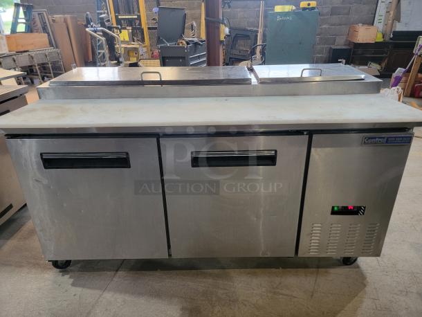Central 69K-014 stainless steel pizza prep table, ample workspace, tested, ideal for commercial kitchens.