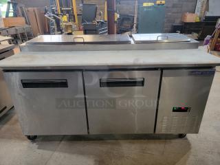 Central 69K-014 stainless steel pizza prep table, ample workspace, tested, ideal for commercial kitchens.