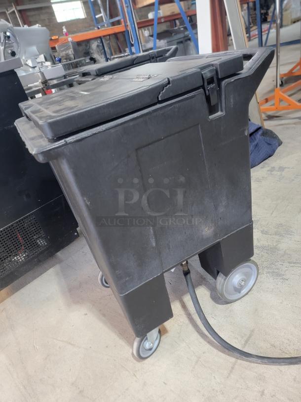 Carlisle 175lb mobile ice caddie, black, with hinged lid and caster wheels. Signs of wear; ideal for catering use.