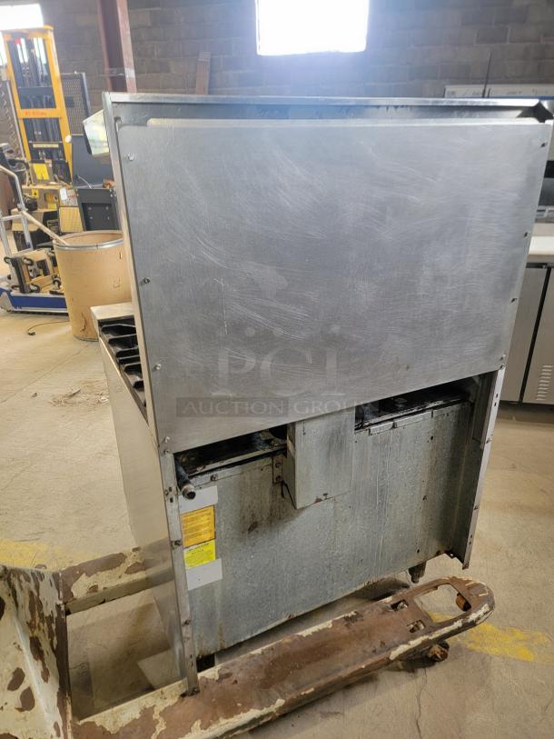 American Range commercial gas range, 6 burners, open-top design, full-size oven below, stainless steel, used condition.