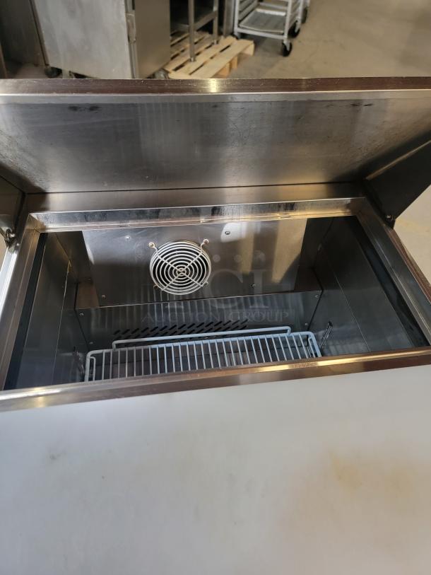 Atosa MSF8301GR Mega Top Sandwich/Salad Prep Refrigerator, stainless steel, excellent condition, open lid showing interior fan and shelf.