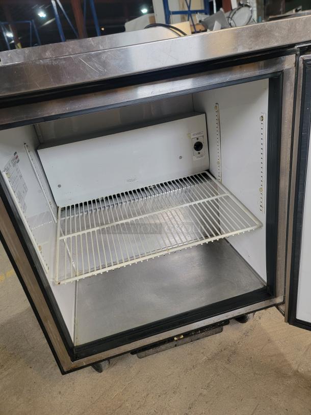 True TWT-27 Commercial Worktop Refrigerator, stainless steel, on casters, tested and working, open door showing interior shelving.