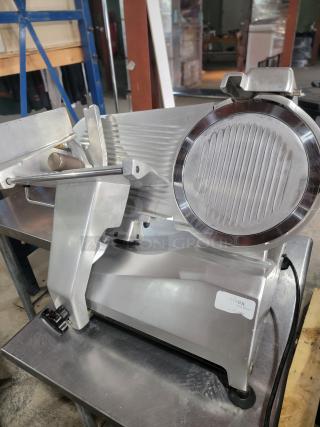 Univex commercial meat slicer, heavy-duty, missing knob, excellent for meats, cheeses, and vegetables, great condition.