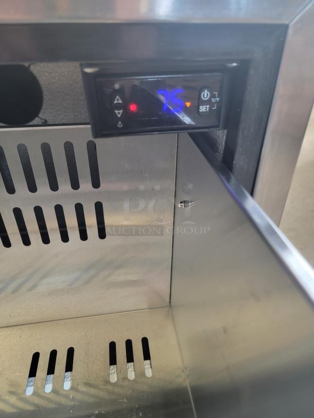 HCK Model D150 outdoor drawer refrigerator, stainless steel interior, digital temperature display showing 75°F, tested and working.