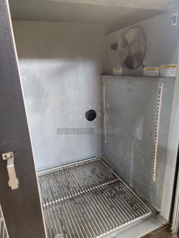 Beverage-Air BB48G back bar cooler interior, showing metal shelves and ventilation. Ideal for chilling beverages.