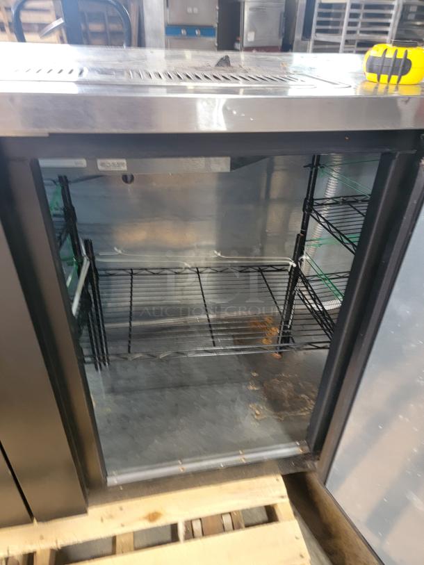 True TDD-4-HC commercial draft beer dispenser, four taps, stainless steel, tested and working. Model label visible inside.