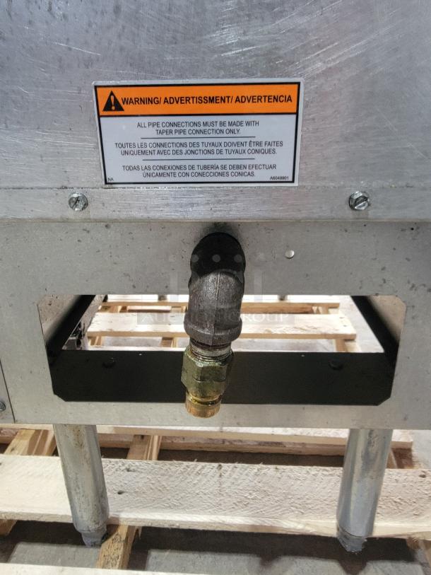 Pitco Frialator SG14 commercial gas deep fryer with LP gas connection, warning label on proper pipe connections visible.