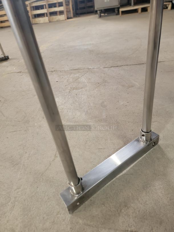 Amgood 6' stainless double over shelf base with metal legs and cross brace, polished finish, excellent condition.