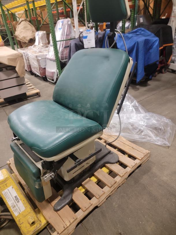 Midmark 75L Medical Examination Chair, green upholstery, adjustable, power features, on wooden pallet, durable condition.