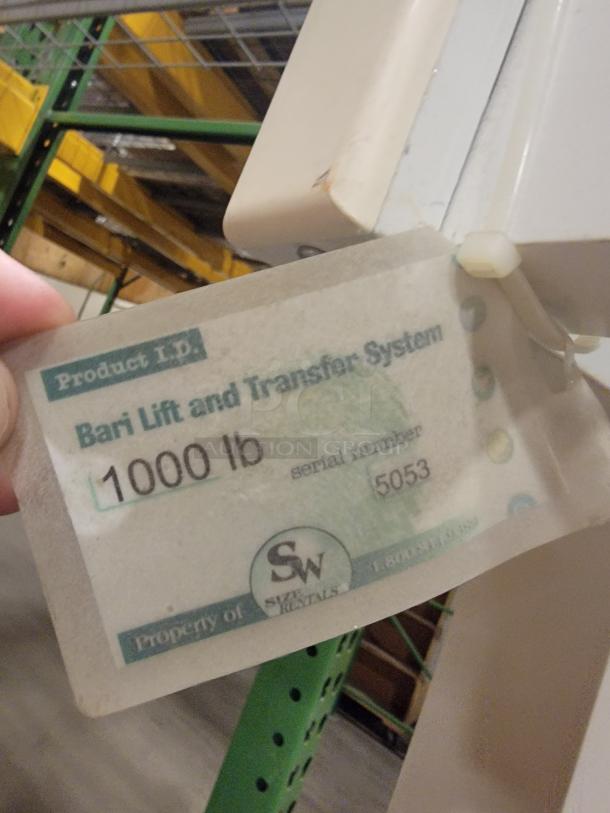 CM Assist 1000 lift system, 1000 lb capacity, beige frame. Tag shows "Bari Lift and Transfer System," serial 5053.