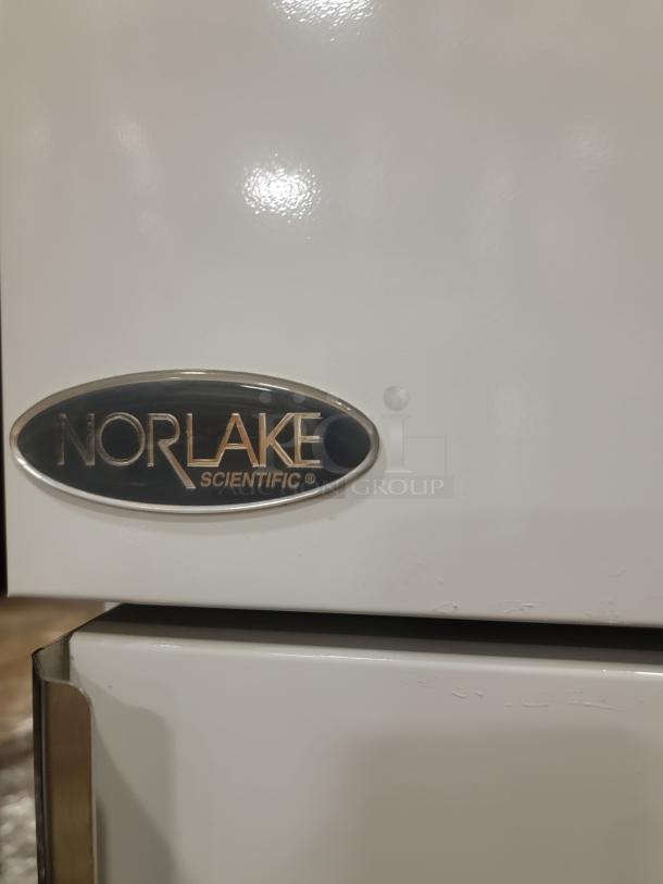 Norlake Scientific freezer, model NSPF241WWW/0, commercial-grade, ideal for restaurant use. Visible Norlake logo on door.