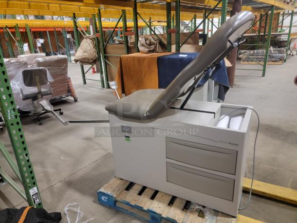 Brewer Access Heavy Duty Power Table in warehouse, adjustable top, storage drawers, good condition, versatile use.