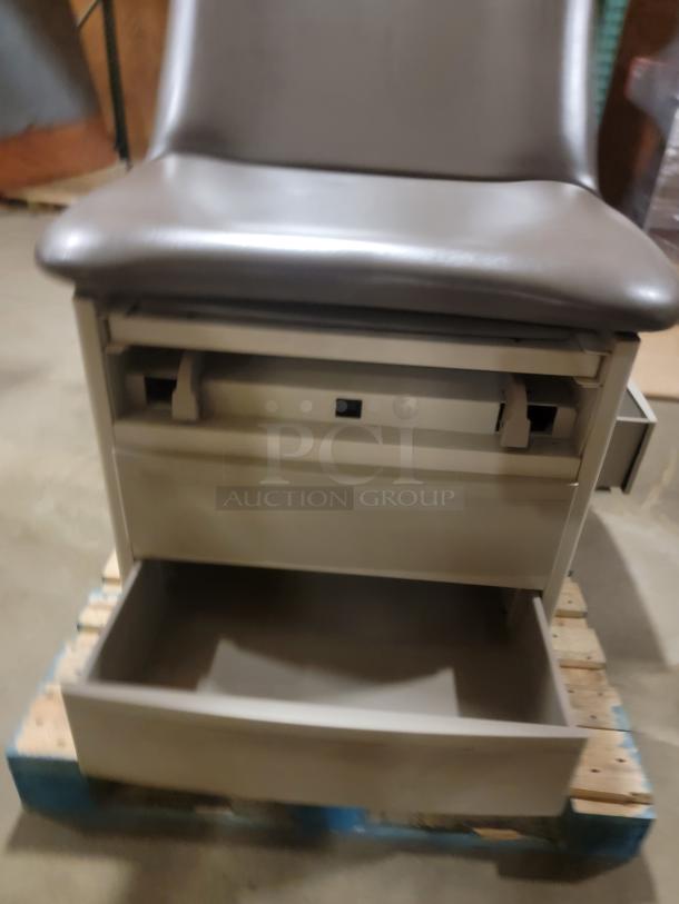 Brewer Access examination table, featuring a durable design, storage drawer open, ideal for multifunctional use.