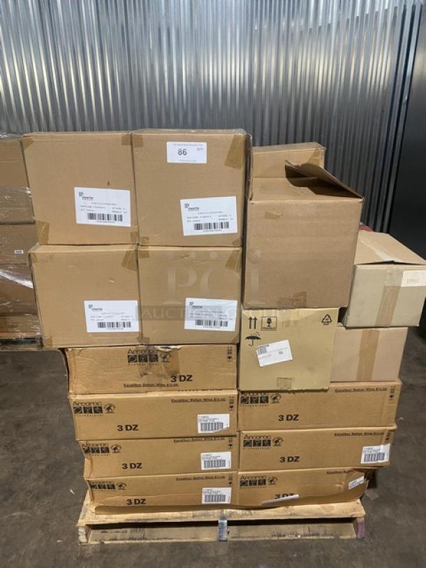 Stack of assorted cardboard boxes on a pallet, featuring shipping labels and identifiers; condition appears good.