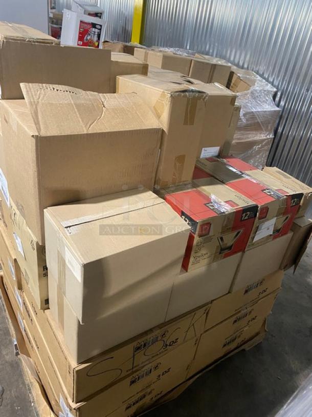 Pallet of assorted boxed items including coffee makers; mixed brands and sizes; boxes appear taped and in fair condition.